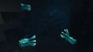 Glow squids "lighting" up an underwater cave (Image via Mojang)